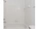 White tiled bathroom with a shower/tub combo at 2400 Feather Sound Dr # 913, Clearwater, FL 33762