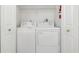 Laundry closet with washer and dryer at 2400 Feather Sound Dr # 913, Clearwater, FL 33762