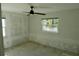 Spacious bedroom with ceiling fan and window at 2660 Miriam S St, Gulfport, FL 33711