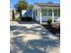 Long driveway leading to a charming white house at 2660 Miriam S St, Gulfport, FL 33711