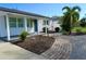 Landscaped front yard with brick walkway leading to the house entrance at 2660 Miriam S St, Gulfport, FL 33711