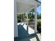 Covered porch with white columns and view of the front yard at 2660 Miriam S St, Gulfport, FL 33711