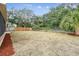 Large backyard with wood fence and landscaping at 2715 Narcissus Dr, Holiday, FL 34691