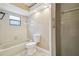 Bathroom with tub, toilet and shower at 2715 Narcissus Dr, Holiday, FL 34691