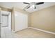 Bedroom with sliding door closet and access to hallway at 2715 Narcissus Dr, Holiday, FL 34691