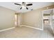 Bedroom with tile floor and access to kitchen at 2715 Narcissus Dr, Holiday, FL 34691