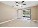 Bedroom with sliding glass doors to patio at 2715 Narcissus Dr, Holiday, FL 34691