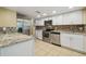 Modern kitchen featuring stainless steel appliances and granite counters at 2715 Narcissus Dr, Holiday, FL 34691