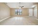 Living room with tile floors and a view of the kitchen at 2715 Narcissus Dr, Holiday, FL 34691