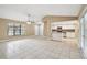 Open concept living room with kitchen and tile floors at 2715 Narcissus Dr, Holiday, FL 34691