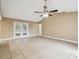 Bright living room featuring tile floors and french doors at 2715 Narcissus Dr, Holiday, FL 34691