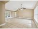 Spacious living room with tile floors and a ceiling fan at 2715 Narcissus Dr, Holiday, FL 34691