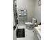 Clean bathroom with toilet, sink, and modern shower at 2801 Auburn W Ave, Tampa, FL 33614