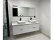 Double vanity bathroom with floating cabinets at 2801 Auburn W Ave, Tampa, FL 33614