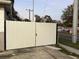 White metal gate leading to the street at 2801 Auburn W Ave, Tampa, FL 33614