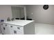 Modern kitchen island with white cabinets and breakfast bar seating at 2801 Auburn W Ave, Tampa, FL 33614