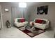 Elegant living room with white couches and a glass coffee table at 2801 Auburn W Ave, Tampa, FL 33614