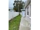 Side yard with concrete path and shed at 2801 Auburn W Ave, Tampa, FL 33614