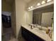 Bathroom with double vanity, soaking tub, and walk-in shower at 2878 Grand Kemerton Pl, Tampa, FL 33618