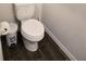 Simple bathroom with toilet and dark tile floor at 2878 Grand Kemerton Pl, Tampa, FL 33618