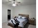 Spacious bedroom with large bed, ceiling fan, and ensuite bathroom at 2878 Grand Kemerton Pl, Tampa, FL 33618