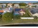 Aerial view of a house with solar panels and a pool at 3190 Shoreline Dr, Clearwater, FL 33760