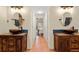 Double vanity bathroom with rustic wooden cabinets at 3190 Shoreline Dr, Clearwater, FL 33760