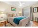 Comfortable bedroom with a king-size bed and a teal blanket at 3190 Shoreline Dr, Clearwater, FL 33760