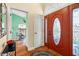 Bright entryway with terracotta tile floors and a view into an adjacent room at 3190 Shoreline Dr, Clearwater, FL 33760