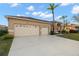 Two-story house with a two-car garage and landscaped yard at 3190 Shoreline Dr, Clearwater, FL 33760