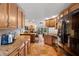 Well-equipped kitchen with granite countertops and wooden cabinetry at 3190 Shoreline Dr, Clearwater, FL 33760