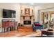 Cozy living room featuring a fireplace and tiled floors at 3190 Shoreline Dr, Clearwater, FL 33760