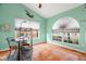 Home office with terracotta tile floors and a large arched window at 3190 Shoreline Dr, Clearwater, FL 33760