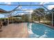 Relaxing pool and patio area with covered seating at 3190 Shoreline Dr, Clearwater, FL 33760