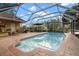 Relaxing screened pool area with brick pavers and seating at 3190 Shoreline Dr, Clearwater, FL 33760