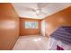 Simple bedroom with beige walls and carpeted floor at 3245 Canal Pl, Land O Lakes, FL 34639