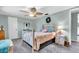 Comfortable bedroom with ceiling fan and nightstand at 3405 Nixon Rd, Holiday, FL 34691