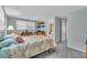 Bright bedroom with a queen-size bed and ensuite bathroom access at 3405 Nixon Rd, Holiday, FL 34691