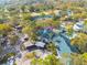 Aerial view of condo building near pool and parking at 3578 Indigo Pond Dr, Palm Harbor, FL 34685