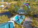 Aerial view of condo community highlighting a pool and building at 3578 Indigo Pond Dr, Palm Harbor, FL 34685