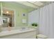 Clean bathroom with white vanity and a shower/tub at 3578 Indigo Pond Dr, Palm Harbor, FL 34685