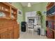 Home office with built-in wooden shelving and a work desk at 3578 Indigo Pond Dr, Palm Harbor, FL 34685