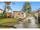 Backyard with detached garage and fire pit at 3915 W Pearl Ave, Tampa, FL 33611