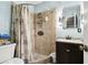 Bathroom with shower stall, vanity, and updated fixtures at 3915 W Pearl Ave, Tampa, FL 33611