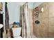 Clean bathroom with shower, toilet and updated vanity at 3915 W Pearl Ave, Tampa, FL 33611