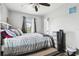 Cozy bedroom featuring a double bed and striped bedding at 3915 W Pearl Ave, Tampa, FL 33611