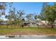 House exterior with black metal fence and yard at 3915 W Pearl Ave, Tampa, FL 33611