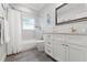 Clean bathroom with a shower/tub combo and white vanity at 3925 1St Ne St, St Petersburg, FL 33703