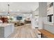 Bright and airy entryway with wood floors and a view into the living room at 3925 1St Ne St, St Petersburg, FL 33703