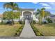 Bright and airy home exterior with manicured landscaping and welcoming entrance at 3925 1St Ne St, St Petersburg, FL 33703